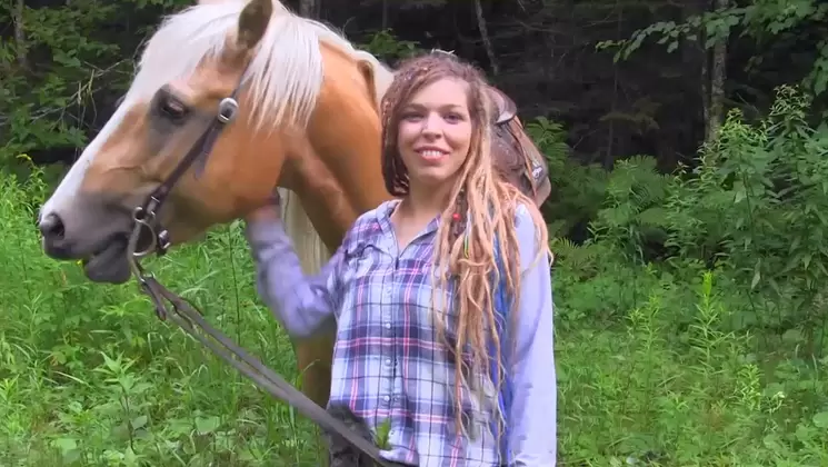 French Rastafarian is Proud of her Horse and Tats