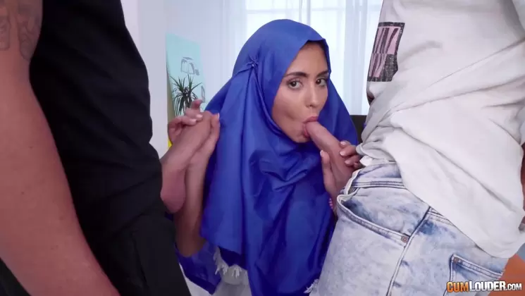 Busty Oriental beauty handles two dicks at a time