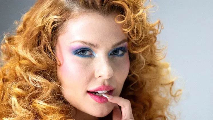 Curvy Californian redhead babe goes nude